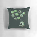 Playful illustration of a swarm of piranhas swimming together on a decorative pillow
