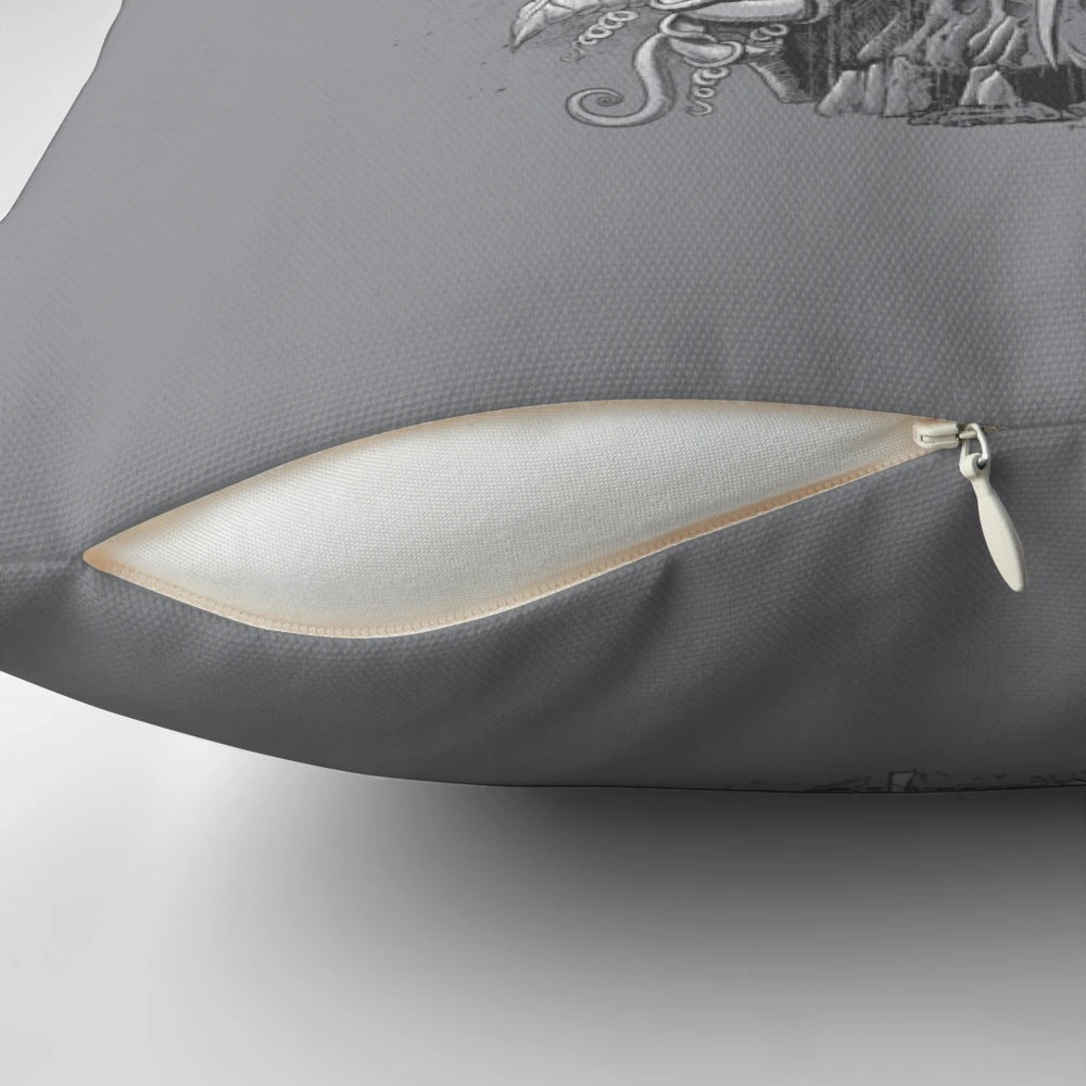 A striking monochrome pillow featuring a detailed raven design with nature elements like flowers, leaves, and vines.