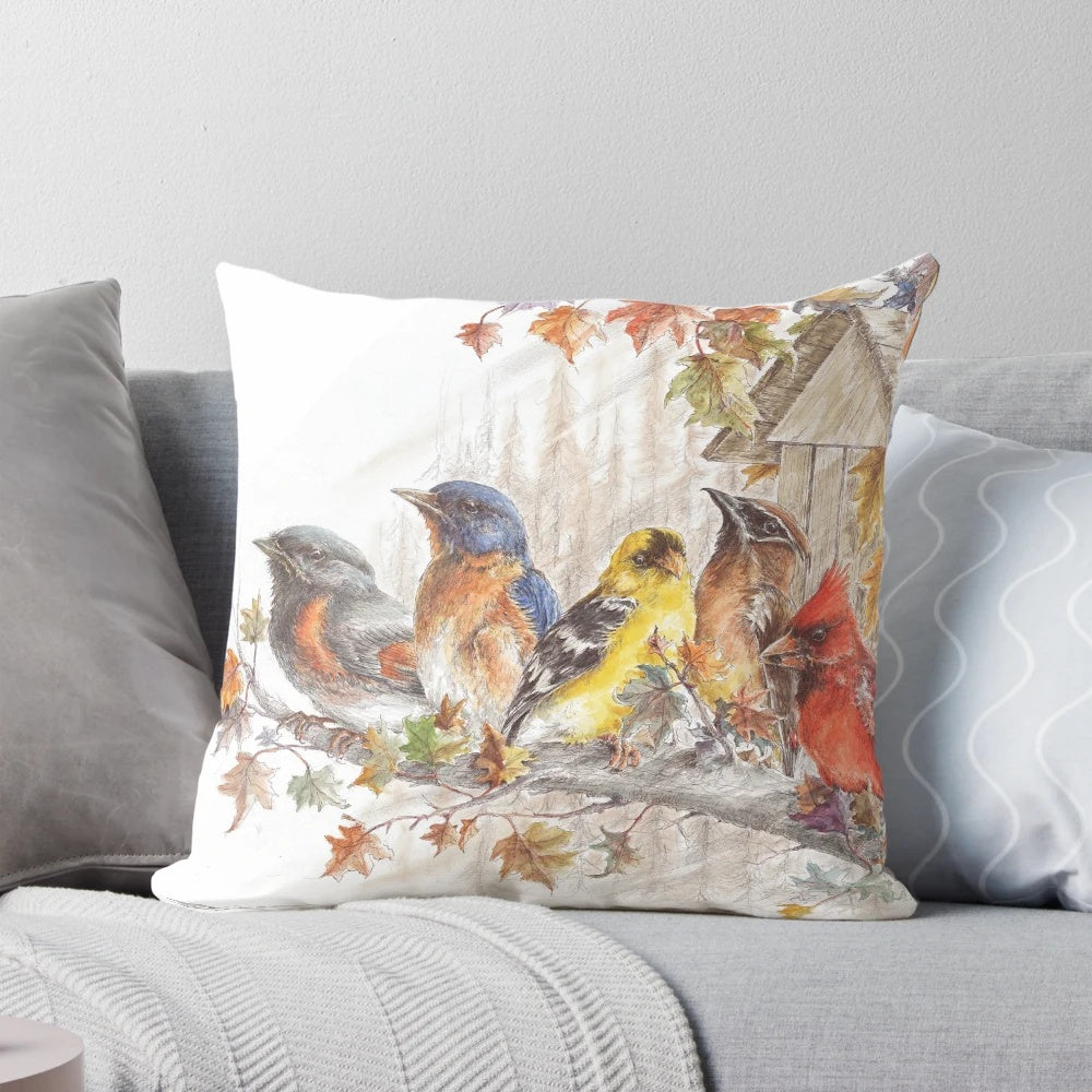 Pillow featuring a stunning wild bird artwork design with a cardinal, blue jay, and finch in a natural setting.
