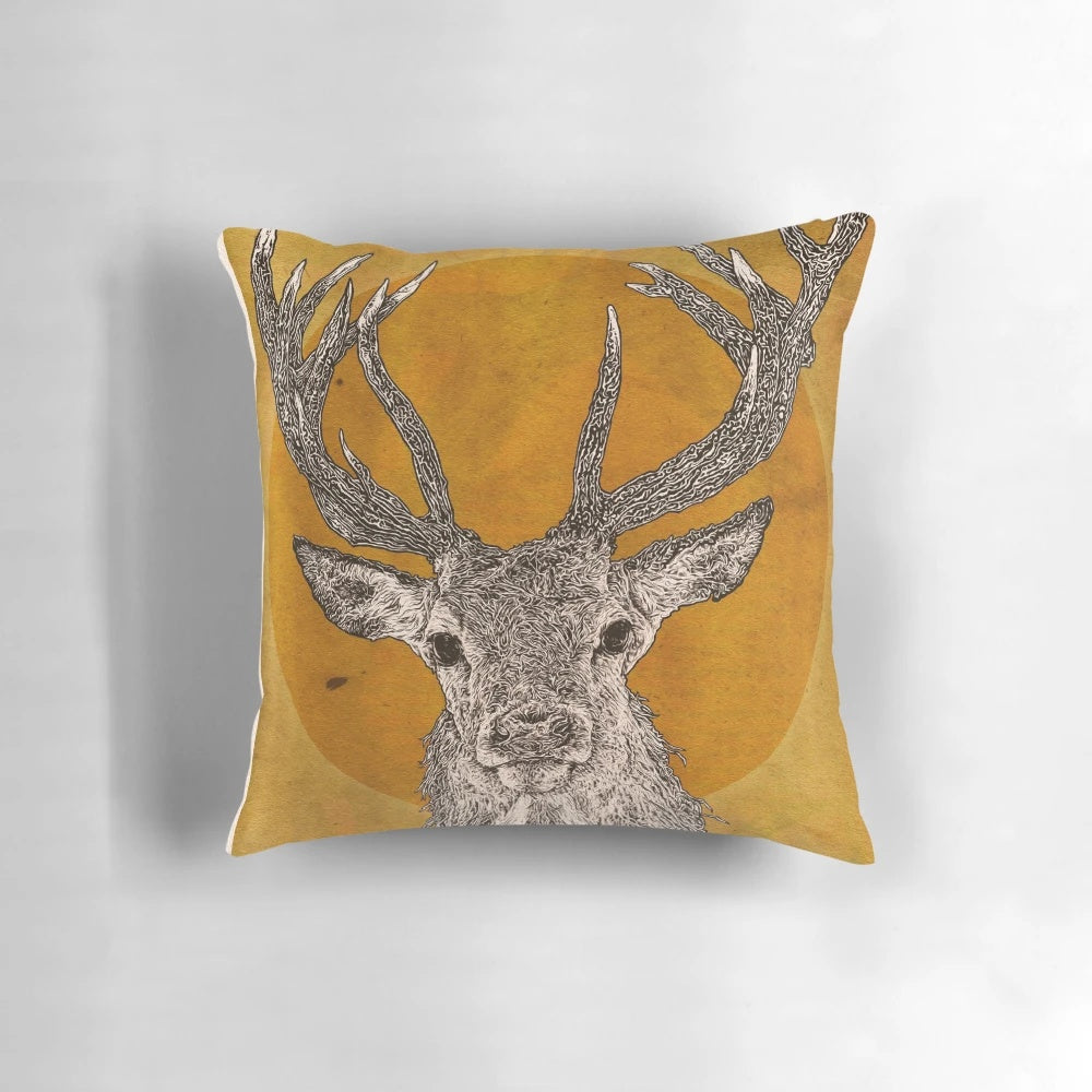 A vibrant, realistic-looking pillow featuring the striking features of a wild stag, including its majestic antlers, expressive eyes, and soft fur.