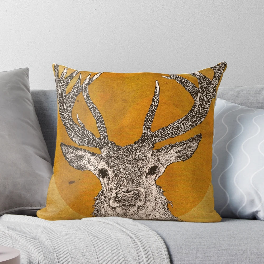 A vibrant, realistic-looking pillow featuring the striking features of a wild stag, including its majestic antlers, expressive eyes, and soft fur.