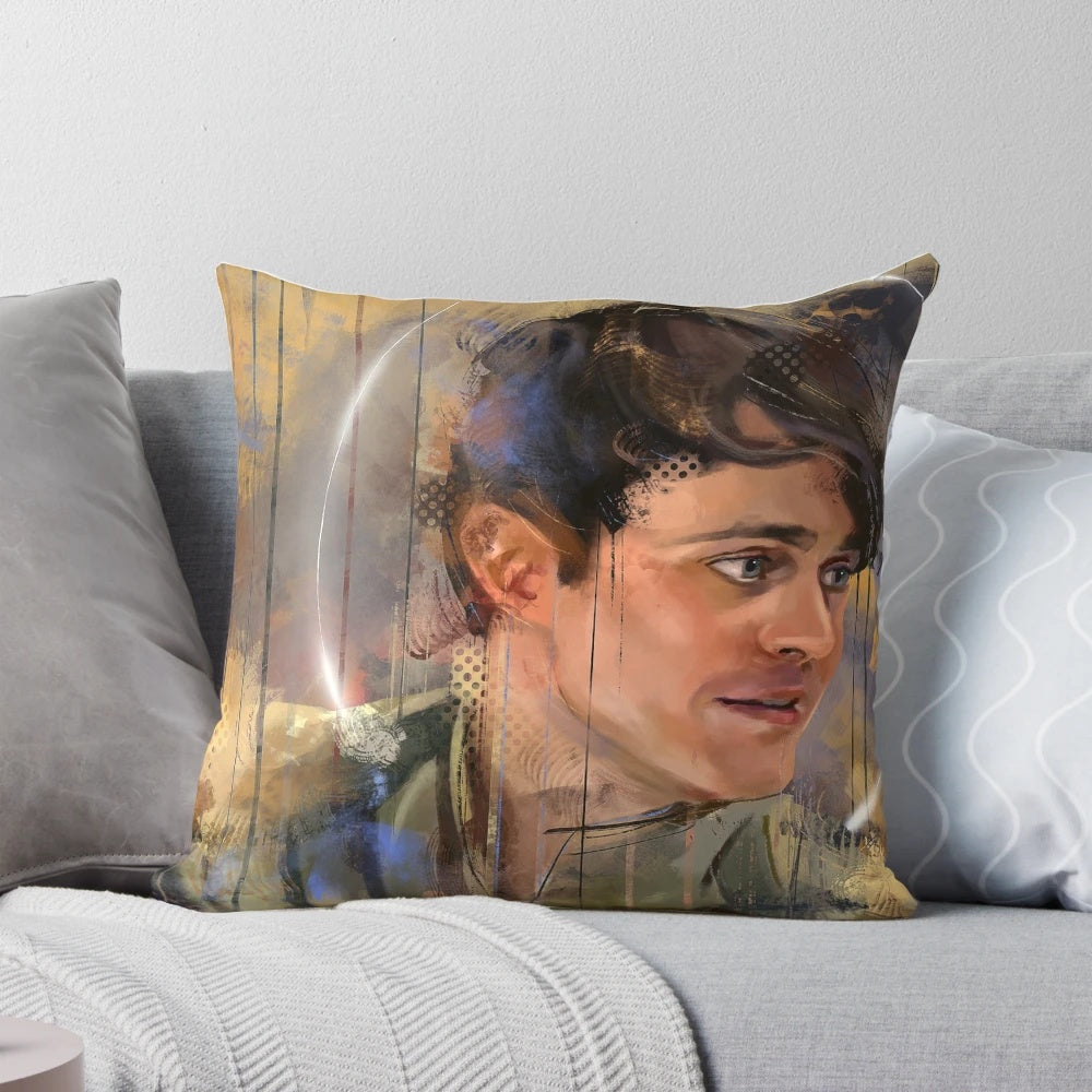 A cozy, decorative pillow featuring a portrait of Joey Batey as The Bard