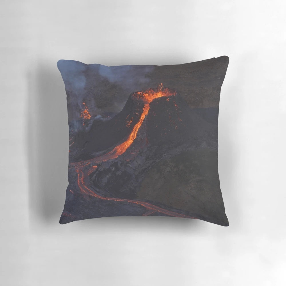 Volcanic eruption inspired pillow featuring fiery red and black lava design