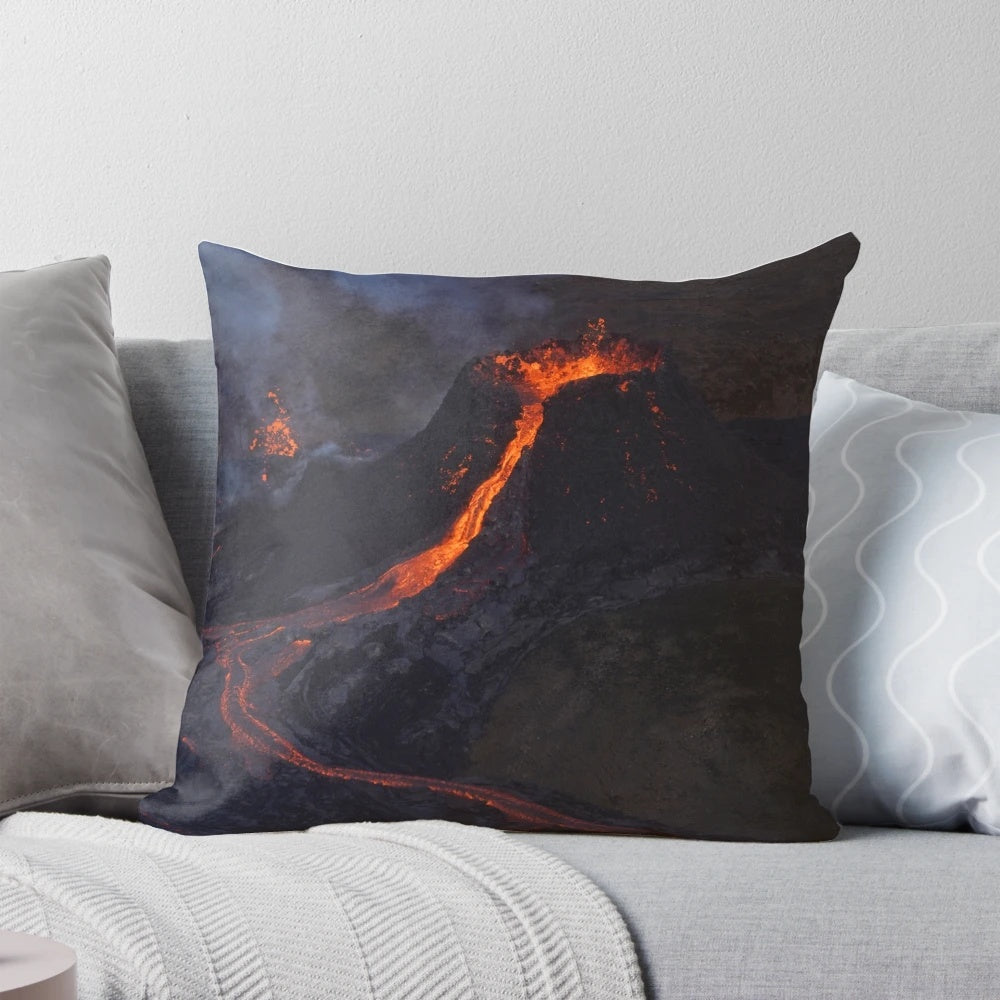 Volcanic eruption inspired pillow featuring fiery red and black lava design