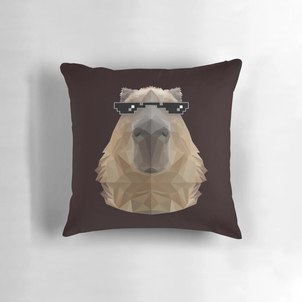 Capybara wearing black sunglasses in a low poly illustration design, displayed on a pillow.