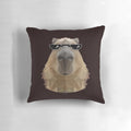 Capybara wearing black sunglasses in a low poly illustration design, displayed on a pillow.