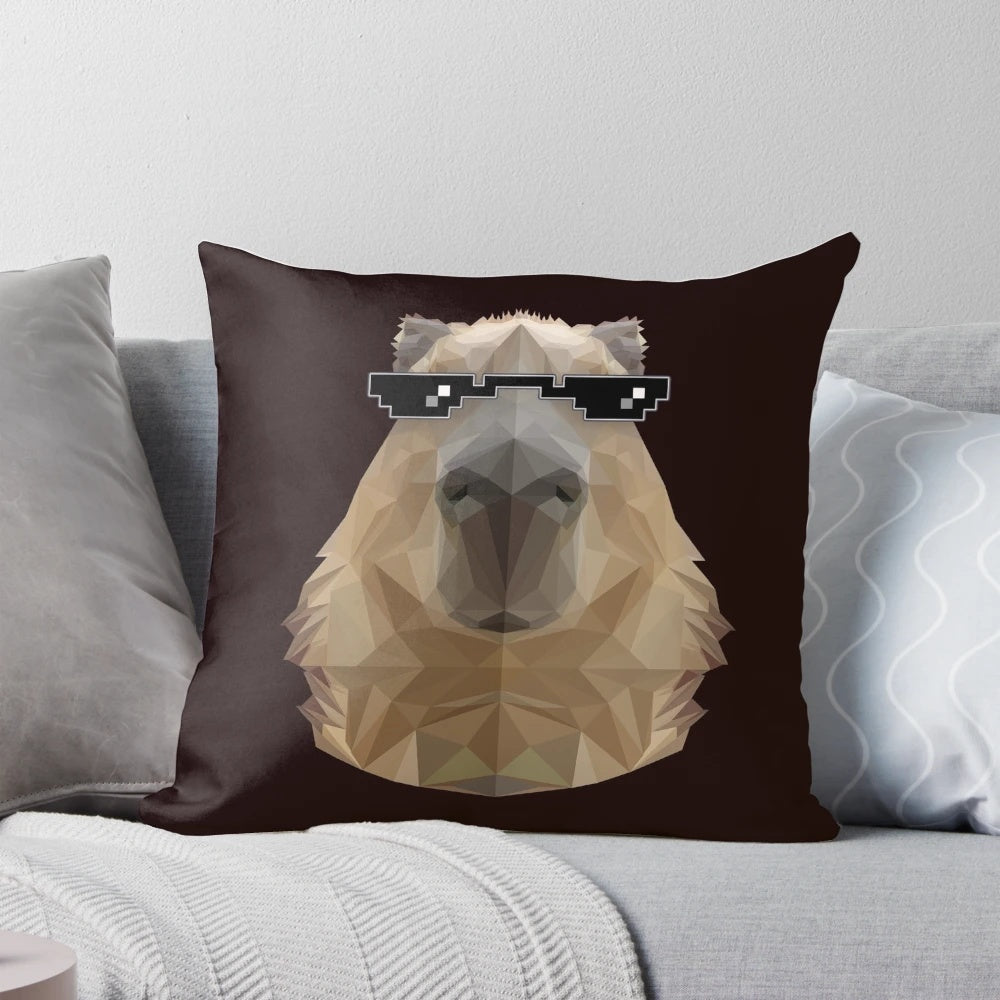 Capybara wearing black sunglasses in a low poly illustration design, displayed on a pillow.