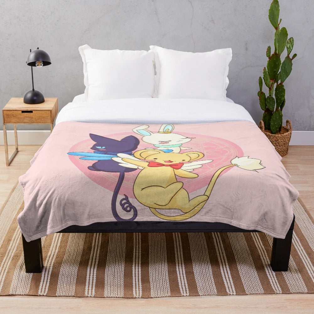 Cardcaptor Sakura inspired plush blanket featuring the three guardians Kero, Spinel, and Momo in a cozy and kawaii design