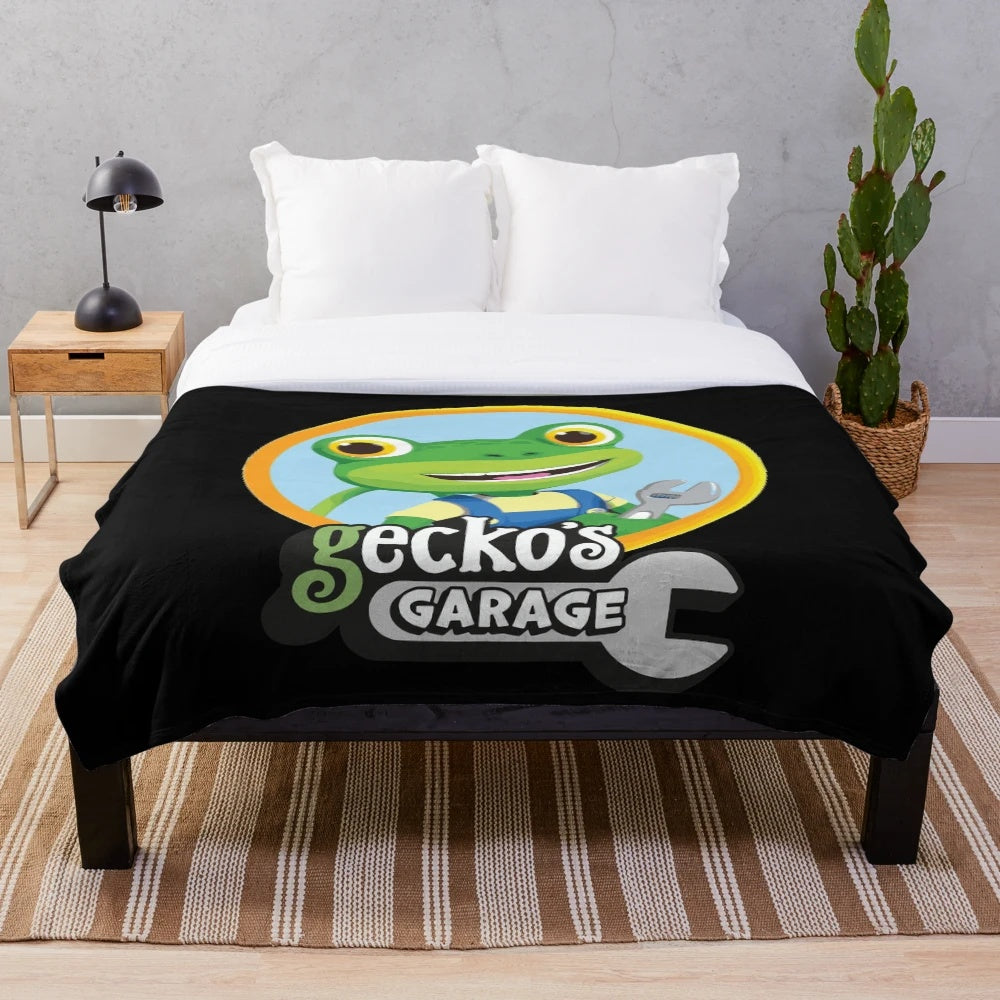 Kids plush blanket with cartoon cars and trucks design