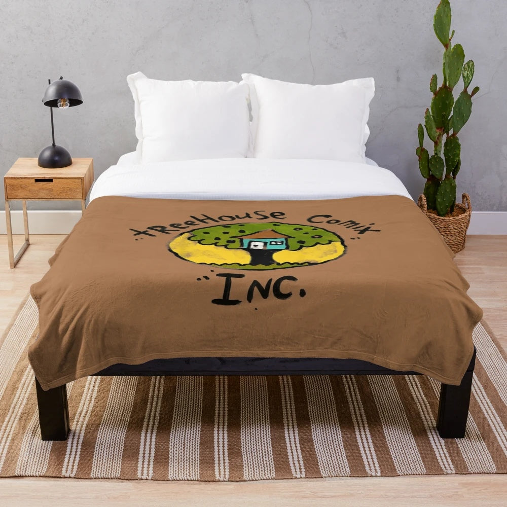 Colorful plush blanket featuring a cartoon underpants design and Treehouse Comix Inc. logo