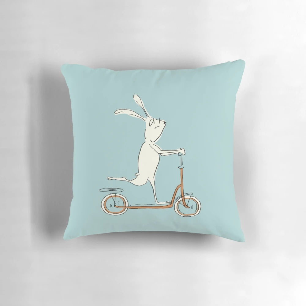 Colorful cartoon scooter pillow with rabbit/bunny design, perfect for kids' bedrooms and Easter decorating.