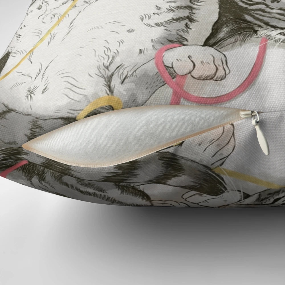 A soft and plush pillow featuring a watercolor design of cats in shades of grey, pink, and rose gold.