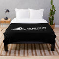 Plush blanket with safety warning message in foreign language