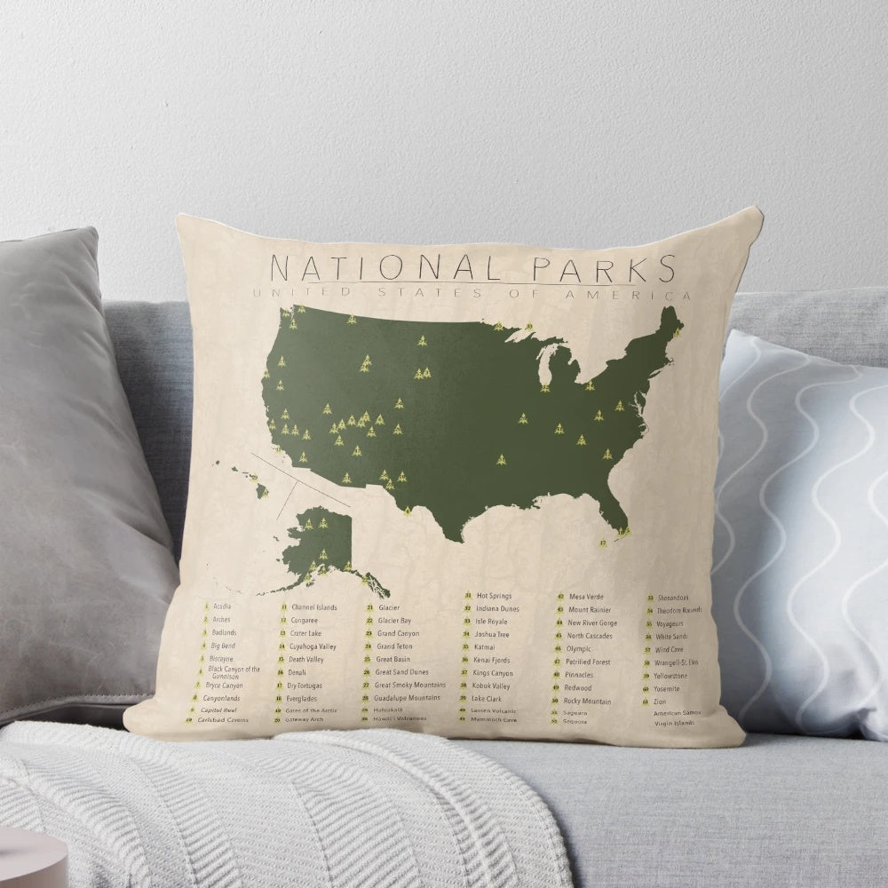Pillow featuring a silhouette design of the United States and national park icons