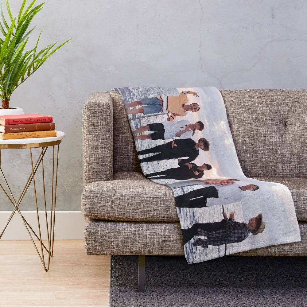 BTS group picture in Hawaii, with members Kim Namjoon, Kim Seokjin, Min Yoongi, Jung Hoseok, Park Jimin, Kim Taehyung, and Jeon Jungkook, printed on a plush blanket