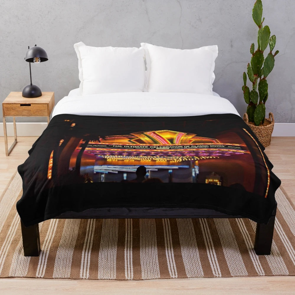Plush blanket featuring classic movie themes and neon lights