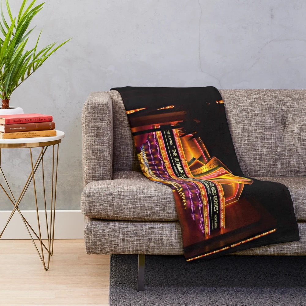 Plush blanket featuring classic movie themes and neon lights