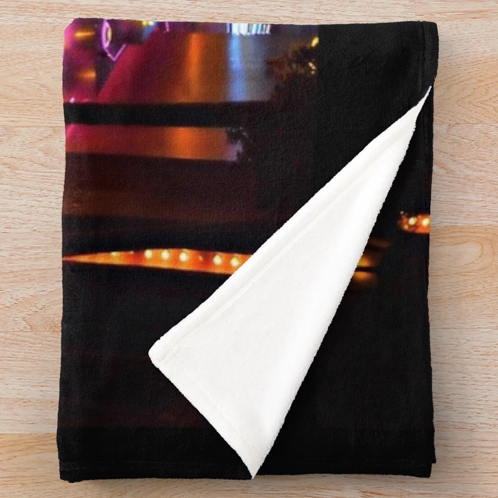 Plush blanket featuring classic movie themes and neon lights