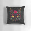 A vibrant day of the dead kitty cat sugar skull pillow featuring intricate floral patterns and a black cat design