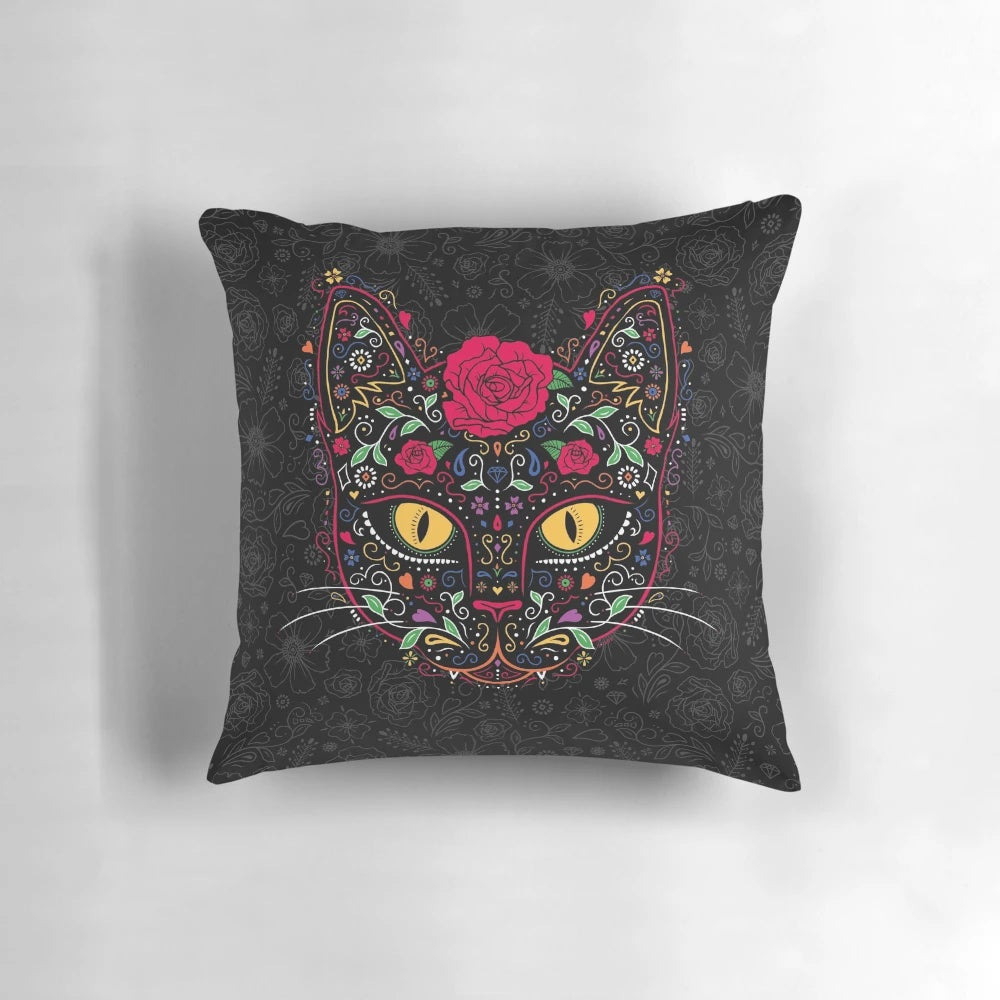 A vibrant day of the dead kitty cat sugar skull pillow featuring intricate floral patterns and a black cat design
