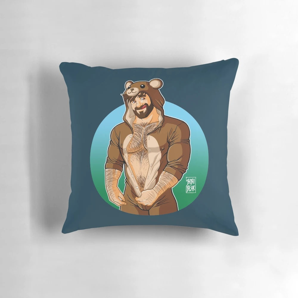 A vibrant, inclusive pillow featuring a bear character surrounded by colorful pride-themed elements.