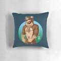 A vibrant, inclusive pillow featuring a bear character surrounded by colorful pride-themed elements.