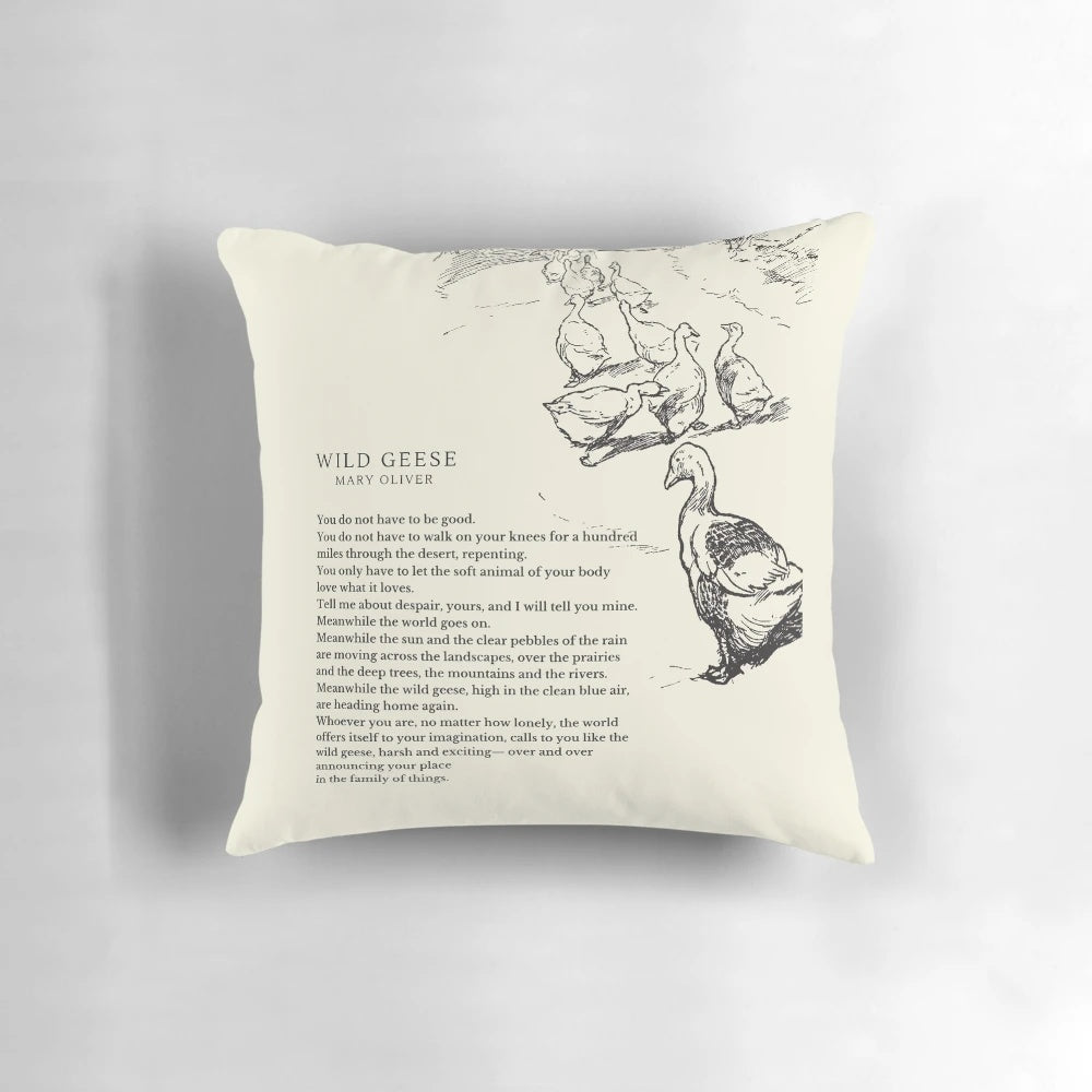 A decorative pillow featuring the "Wild Geese" poem by Mary Oliver, with a design of geese in flight.