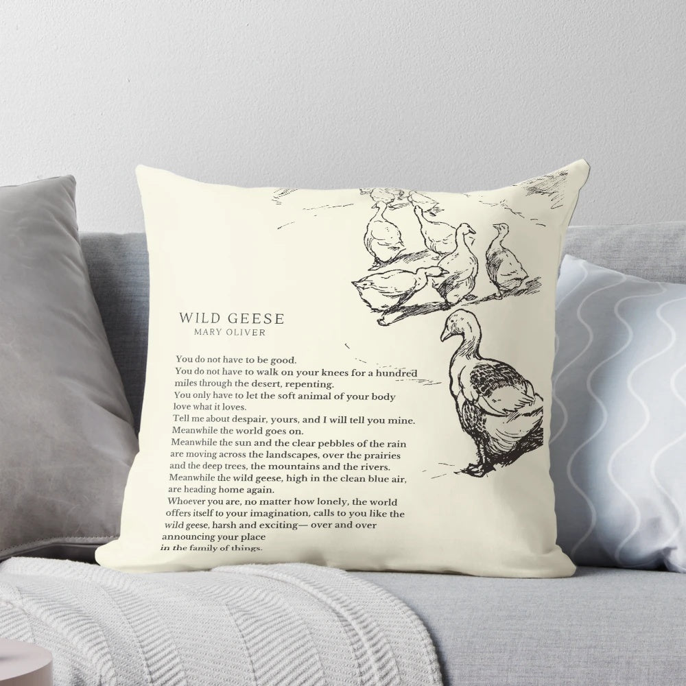 A decorative pillow featuring the "Wild Geese" poem by Mary Oliver, with a design of geese in flight.