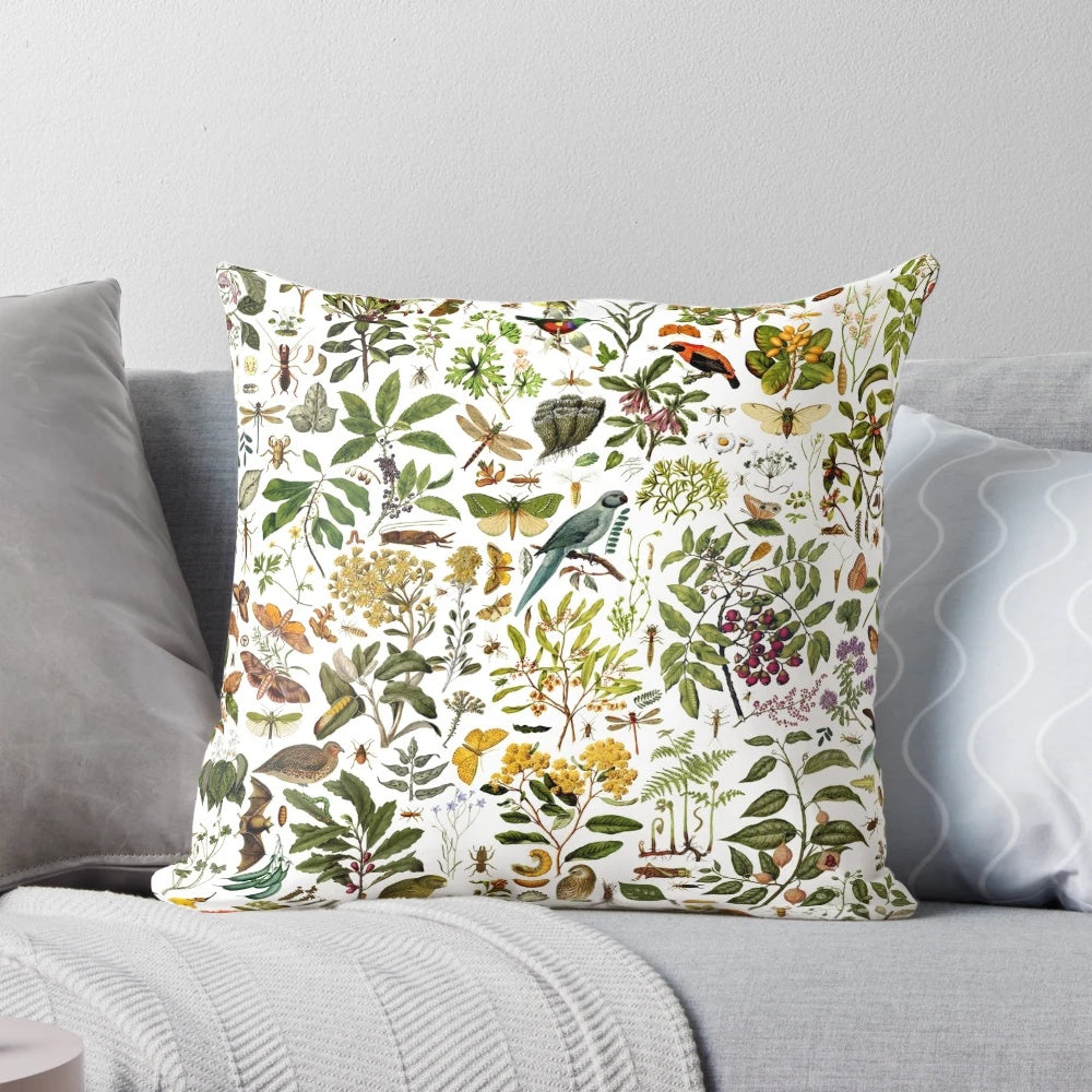 New Zealand-inspired biology pillow featuring a collage of nature elements like butterflies, birds, and flowers.
