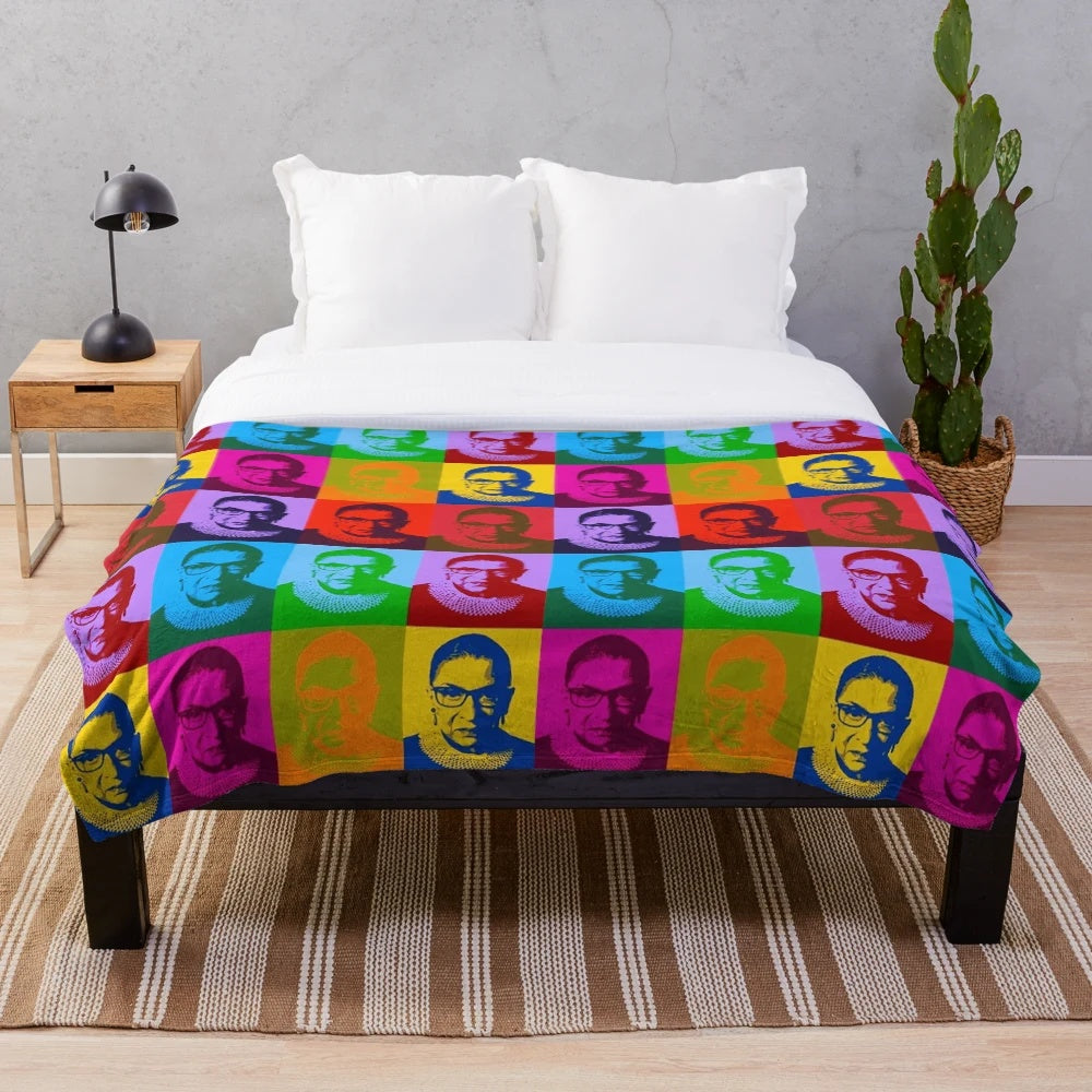 Plush blanket featuring pop art design of legal icon Ruth Bader Ginsburg