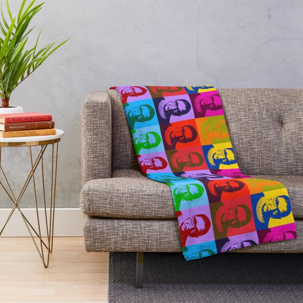 Plush blanket featuring pop art design of legal icon Ruth Bader Ginsburg