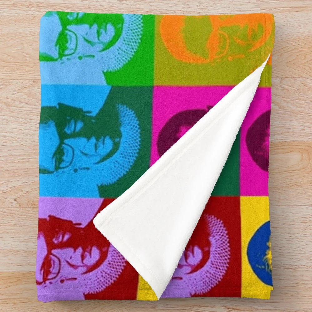 Plush blanket featuring pop art design of legal icon Ruth Bader Ginsburg