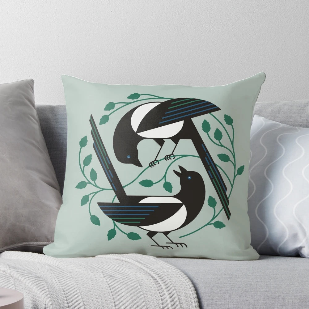 A black and white pillow featuring a minimalist design of a bird, perfect for spring home decor.