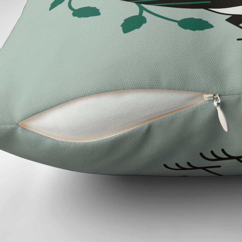 A black and white pillow featuring a minimalist design of a bird, perfect for spring home decor.