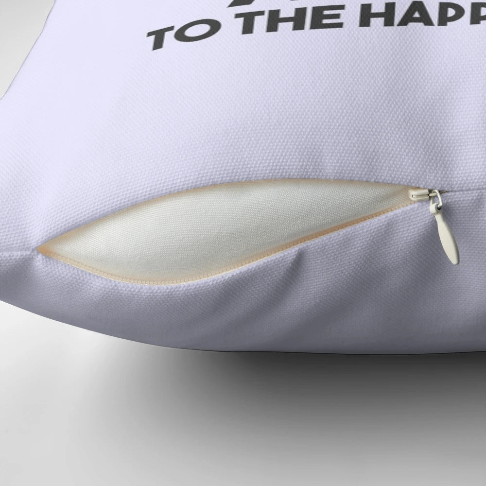 A white and gray accent pillow with the text "A TOAST to the happy couple" as a pun.