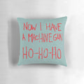A plush pillow featuring the iconic "Now I Have a Machine Gun Ho-Ho-Ho" quote from the classic film Die Hard, featuring Bruce Willis as John McClane.