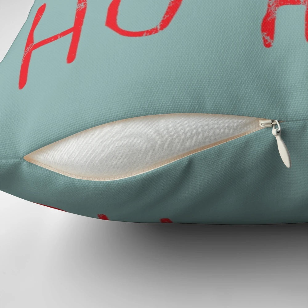 A plush pillow featuring the iconic "Now I Have a Machine Gun Ho-Ho-Ho" quote from the classic film Die Hard, featuring Bruce Willis as John McClane.