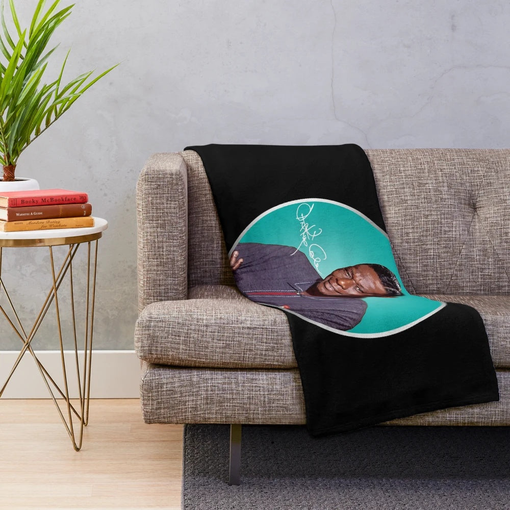 Plush blanket featuring a portrait of jazz icon Nat King Cole
