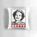A decorative pillow featuring a portrait of actress Betty White, known for her iconic role in the classic TV series "Golden Girls