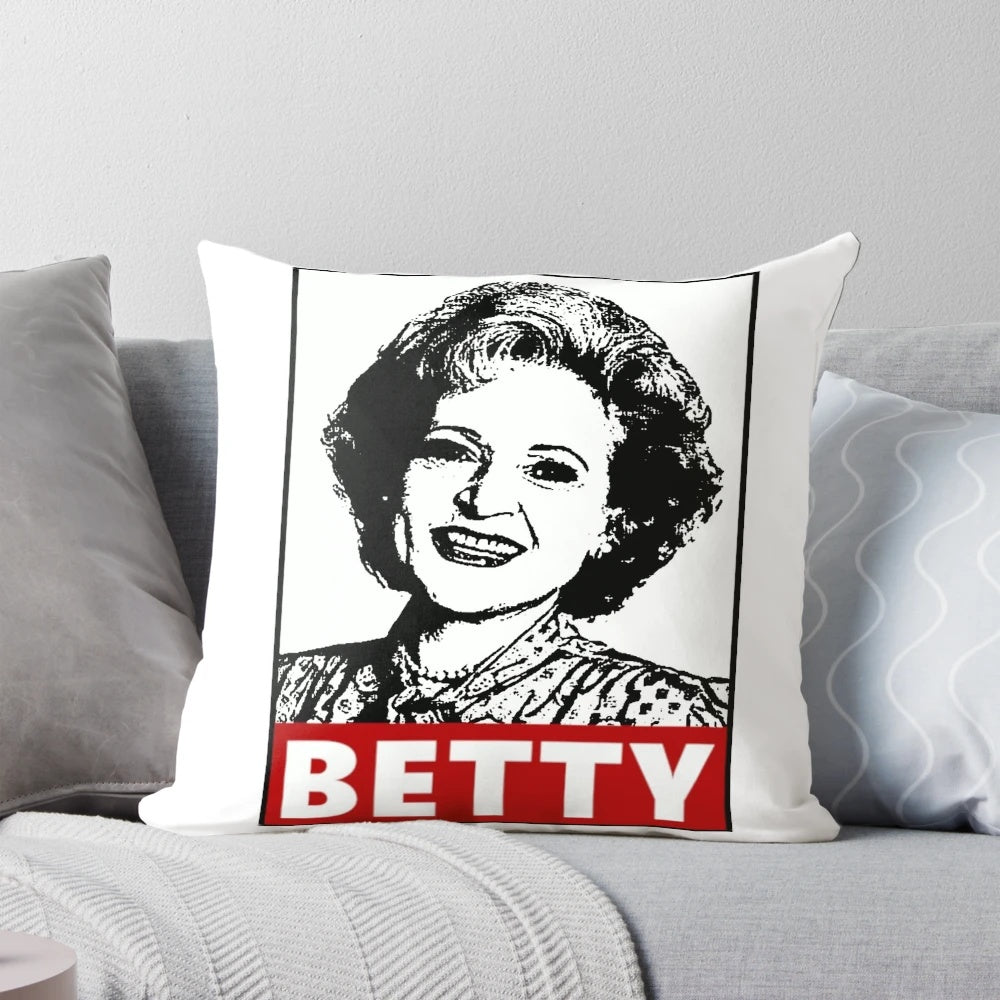 A decorative pillow featuring a portrait of actress Betty White, known for her iconic role in the classic TV series "Golden Girls