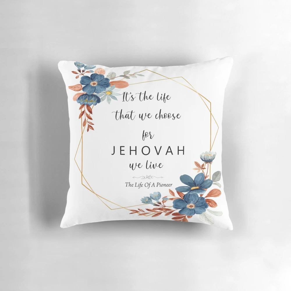 Floral pillow with the text "The Life Of A Pioneer" on it