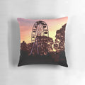 Bonnaroo at Sunset Pillow, featuring a vibrant sunset backdrop with a Ferris wheel and people dancing