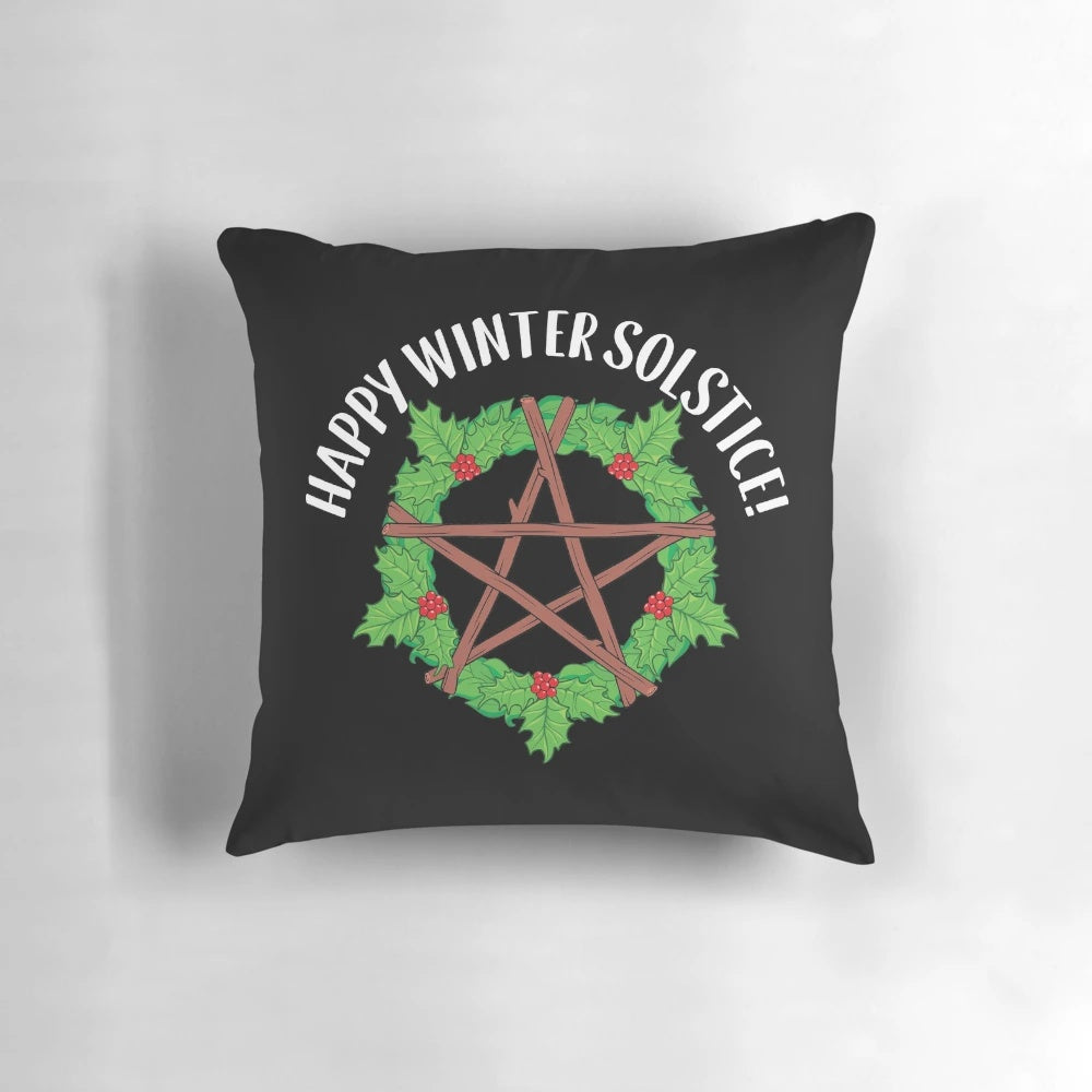 Pagan yule celebration pillow featuring a happy winter solstice graphic design