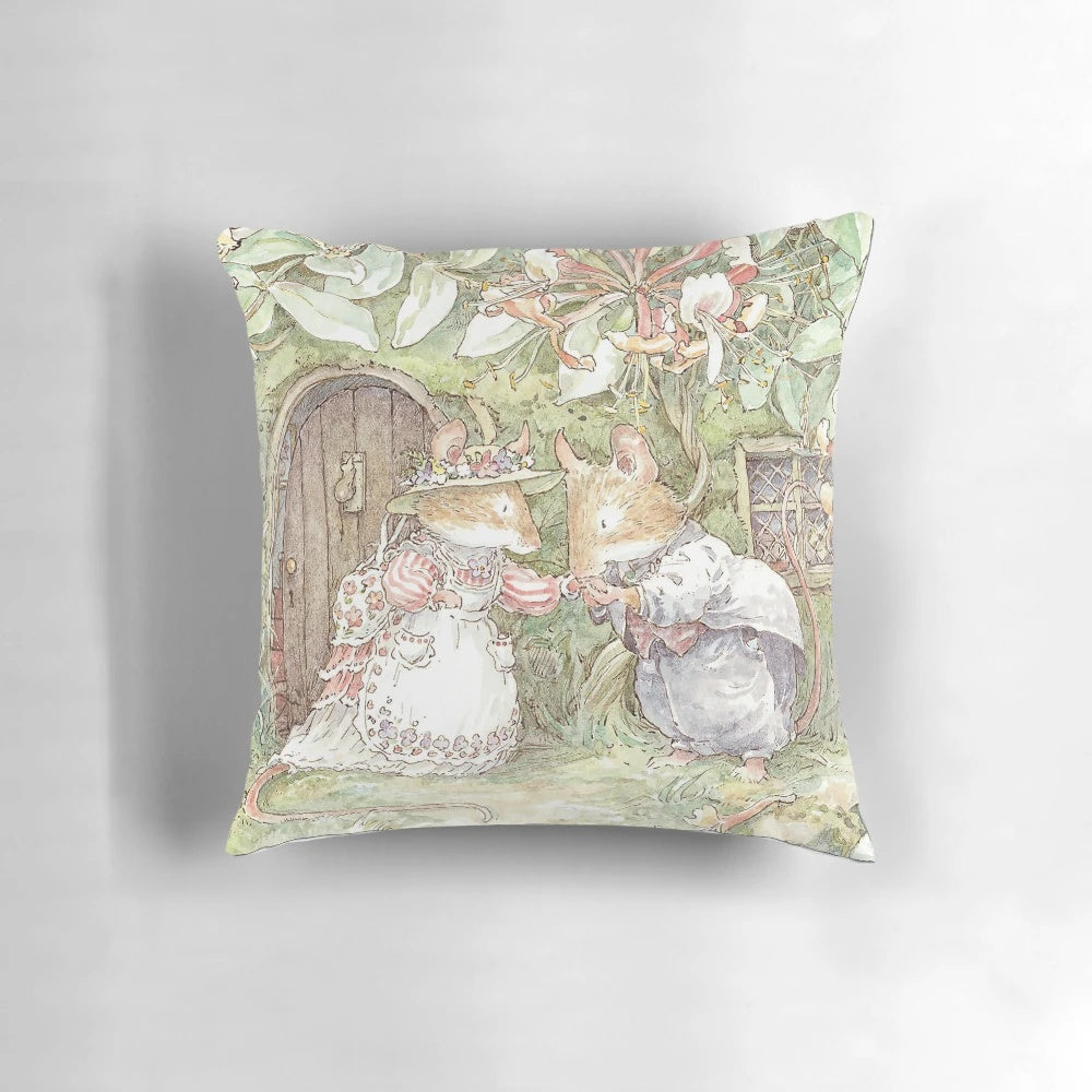 A beautiful pillow featuring illustrations from the classic Brambly Hedge book series, depicting a charming, rural English wedding ceremony.