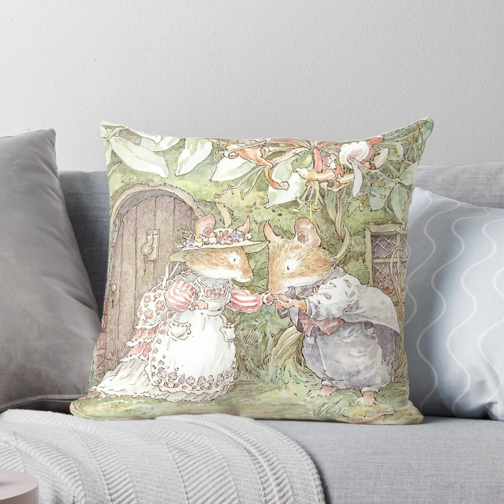 A beautiful pillow featuring illustrations from the classic Brambly Hedge book series, depicting a charming, rural English wedding ceremony.