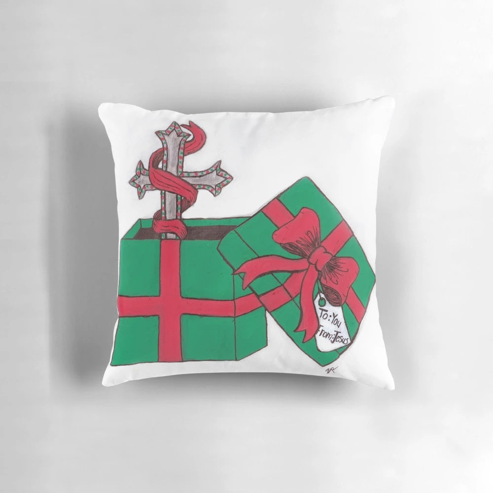 A cozy and inspirational Christian Christmas gift pillow featuring a cross design and festive colors