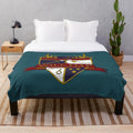 Plush blanket featuring the crest of the Will Hay Appreciation Society
