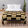 Plush blanket featuring a book cover design for fans