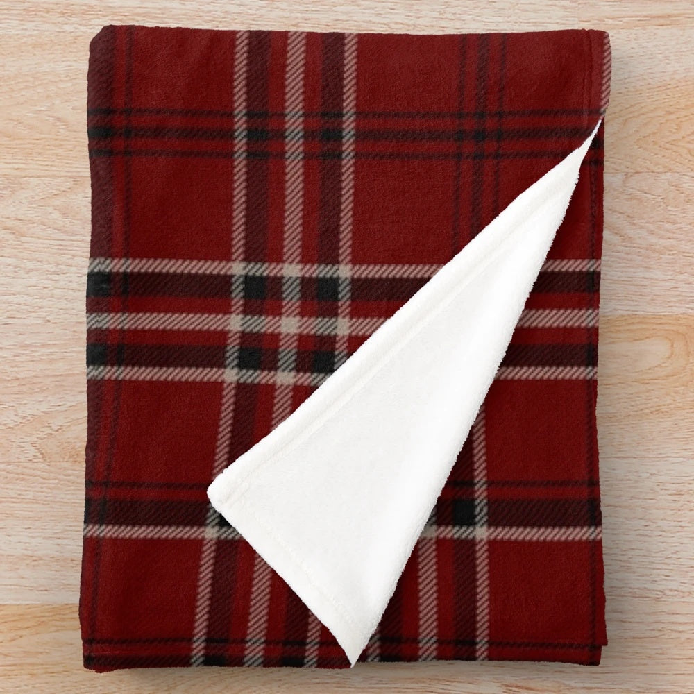 Soft and warm plush blanket featuring a traditional Scottish tartan design