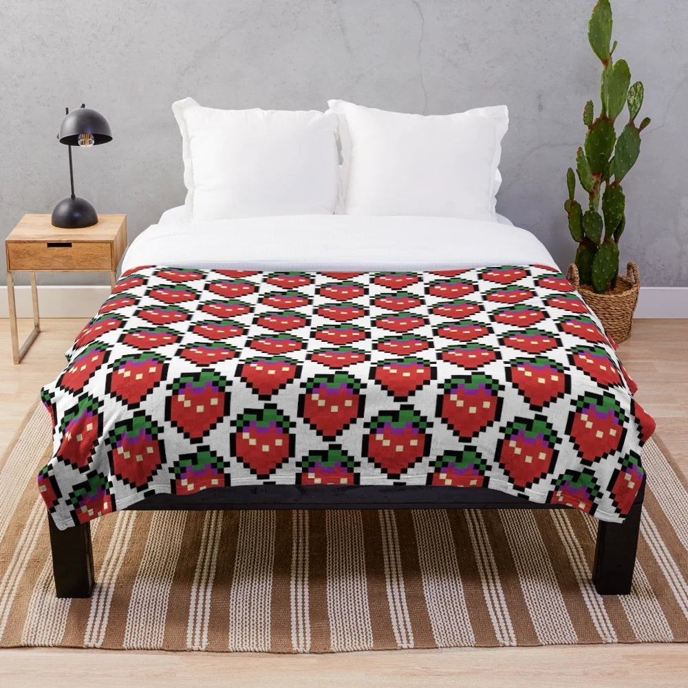 Celeste-inspired plush blanket featuring the game's iconic character Madeline and the Strawberry Sprite